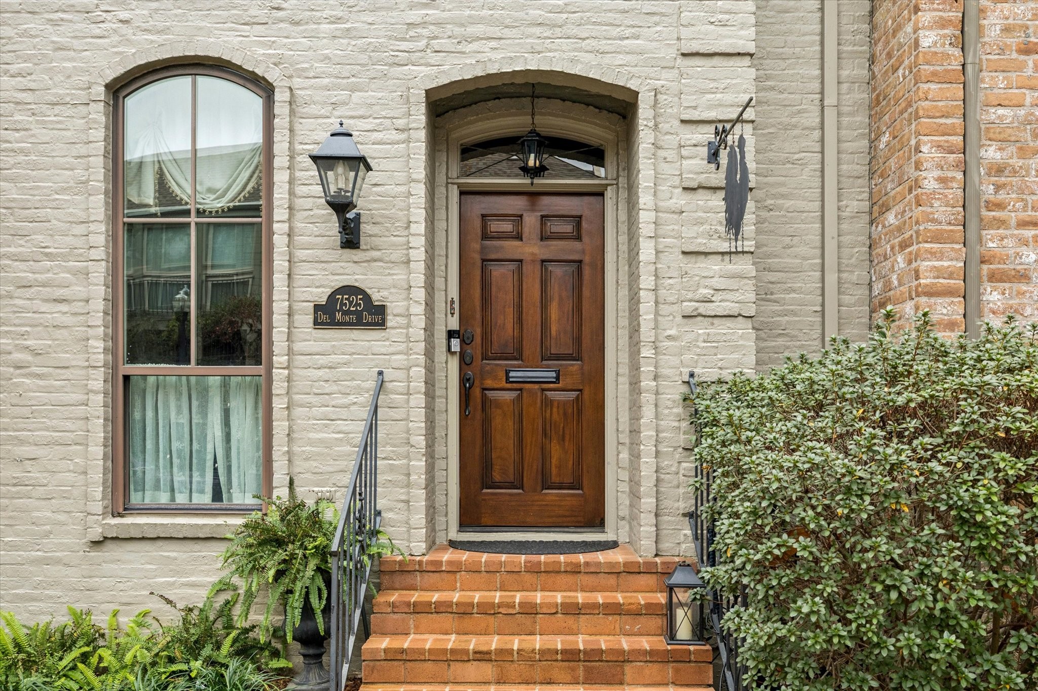 7525 Del Monte Drive Houston, TX 77063 - Photo 2 of 30 a front view of a house with a door and balcony