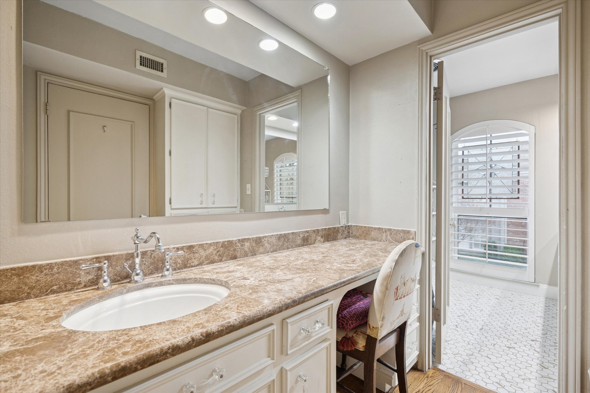 7525 Del Monte Drive Houston, TX 77063 - Photo 21 of 30 a bathroom with a granite countertop sink and a mirror