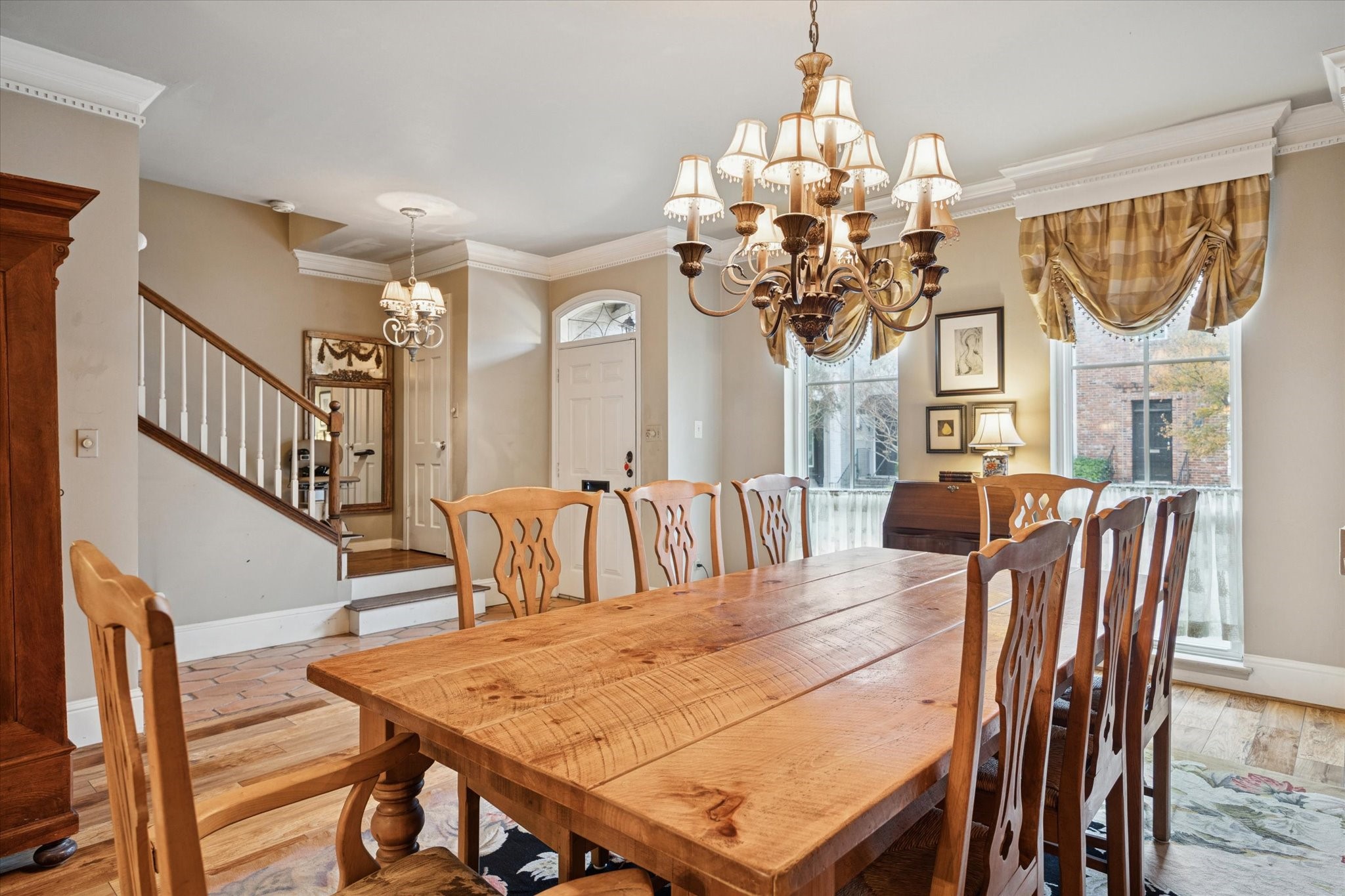 7525 Del Monte Drive Houston, TX 77063 - Photo 7 of 30 a view of a dining room with furniture a chandelier and wooden floor