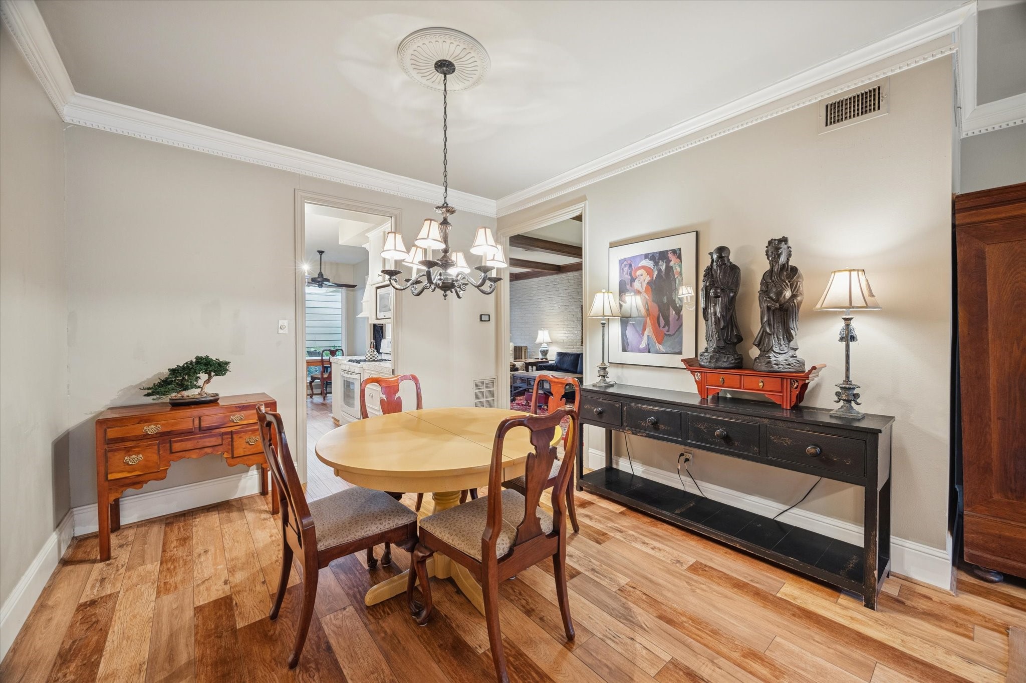 7525 Del Monte Drive Houston, TX 77063 - Photo 10 of 30 a view of a dining room with furniture and chandelier