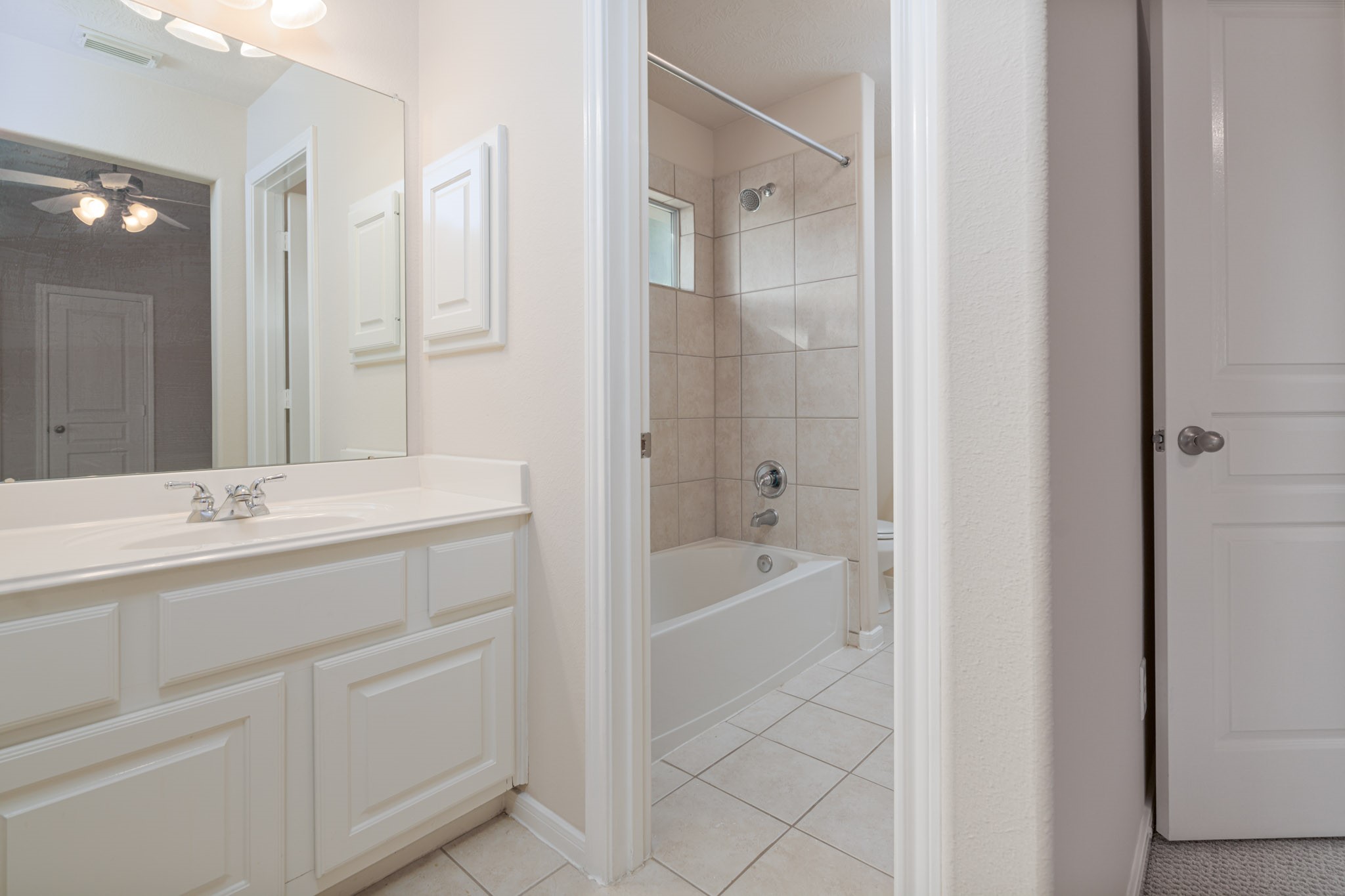 6518 Montana Ridge Court Houston, TX 77041 - Photo 13 of 27 a bathroom with a tub a sink shower and mirror