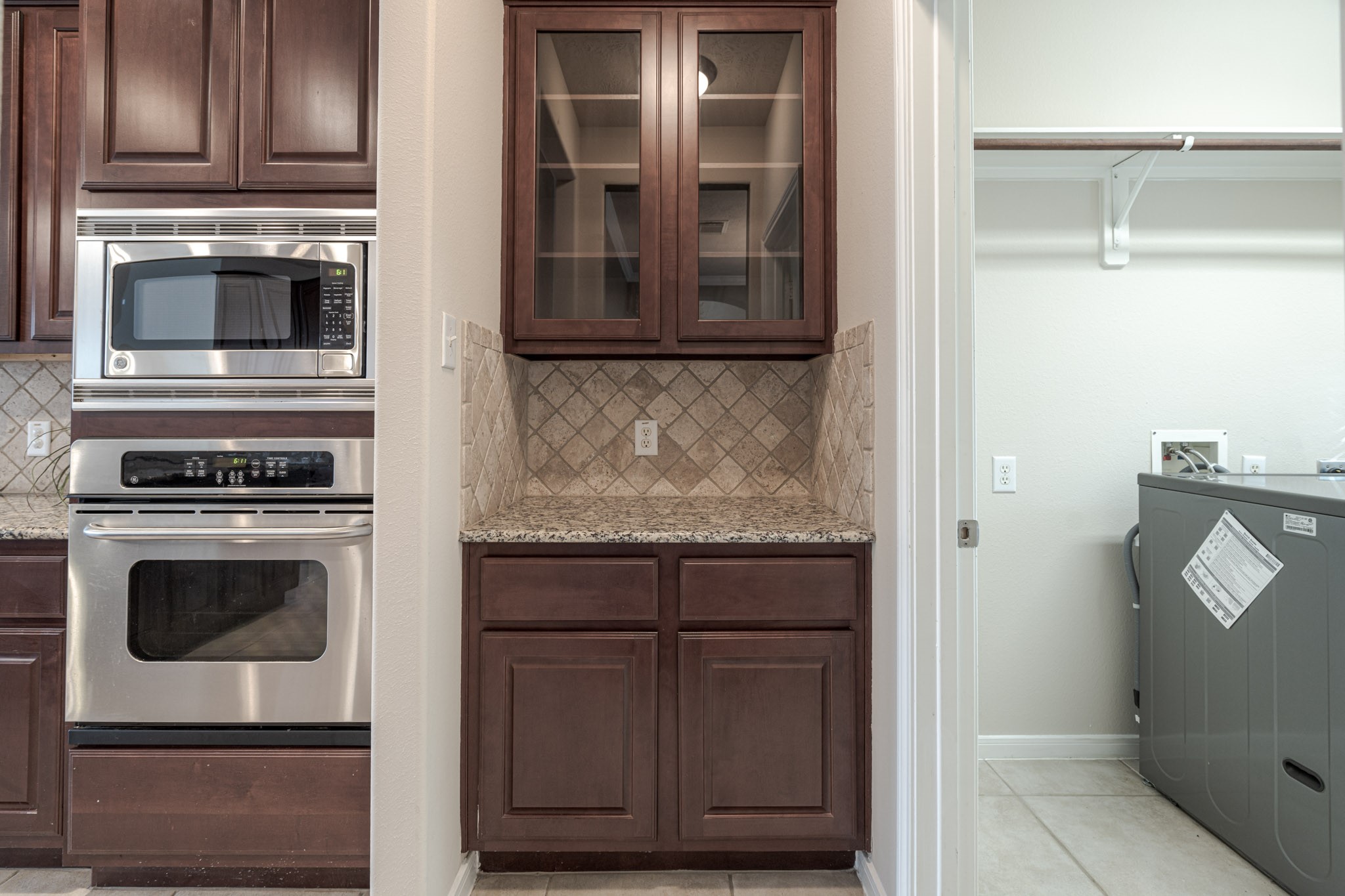 6518 Montana Ridge Court Houston, TX 77041 - Photo 14 of 27 a kitchen with granite countertop cabinets and steel stainless steel appliances