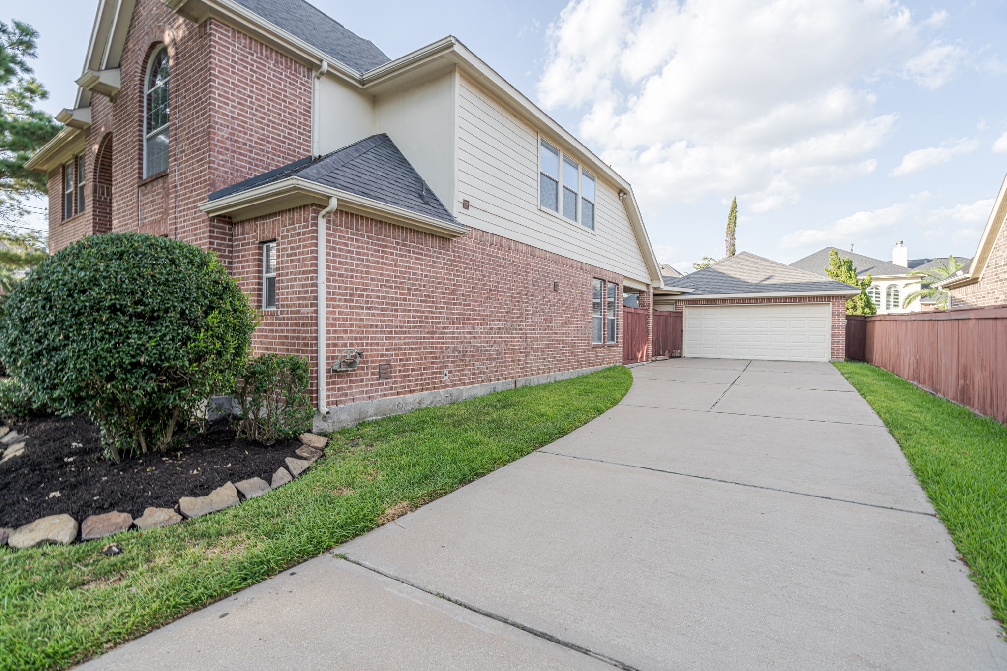 6518 Montana Ridge Court Houston, TX 77041 - Photo 17 of 27 a view of a white house next to a yard and road