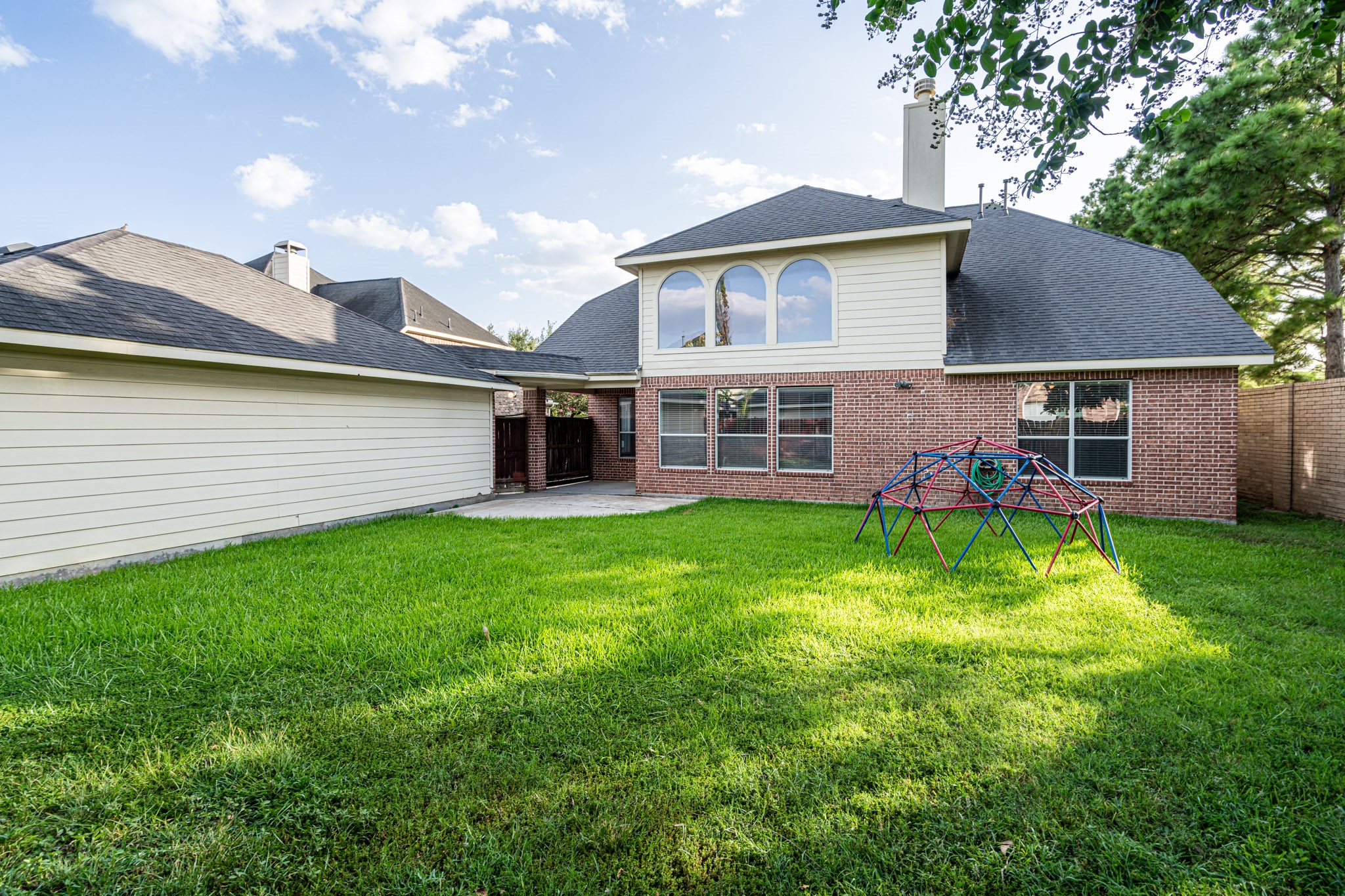 6518 Montana Ridge Court Houston, TX 77041 - Photo 19 of 27 a view of a house with a backyard