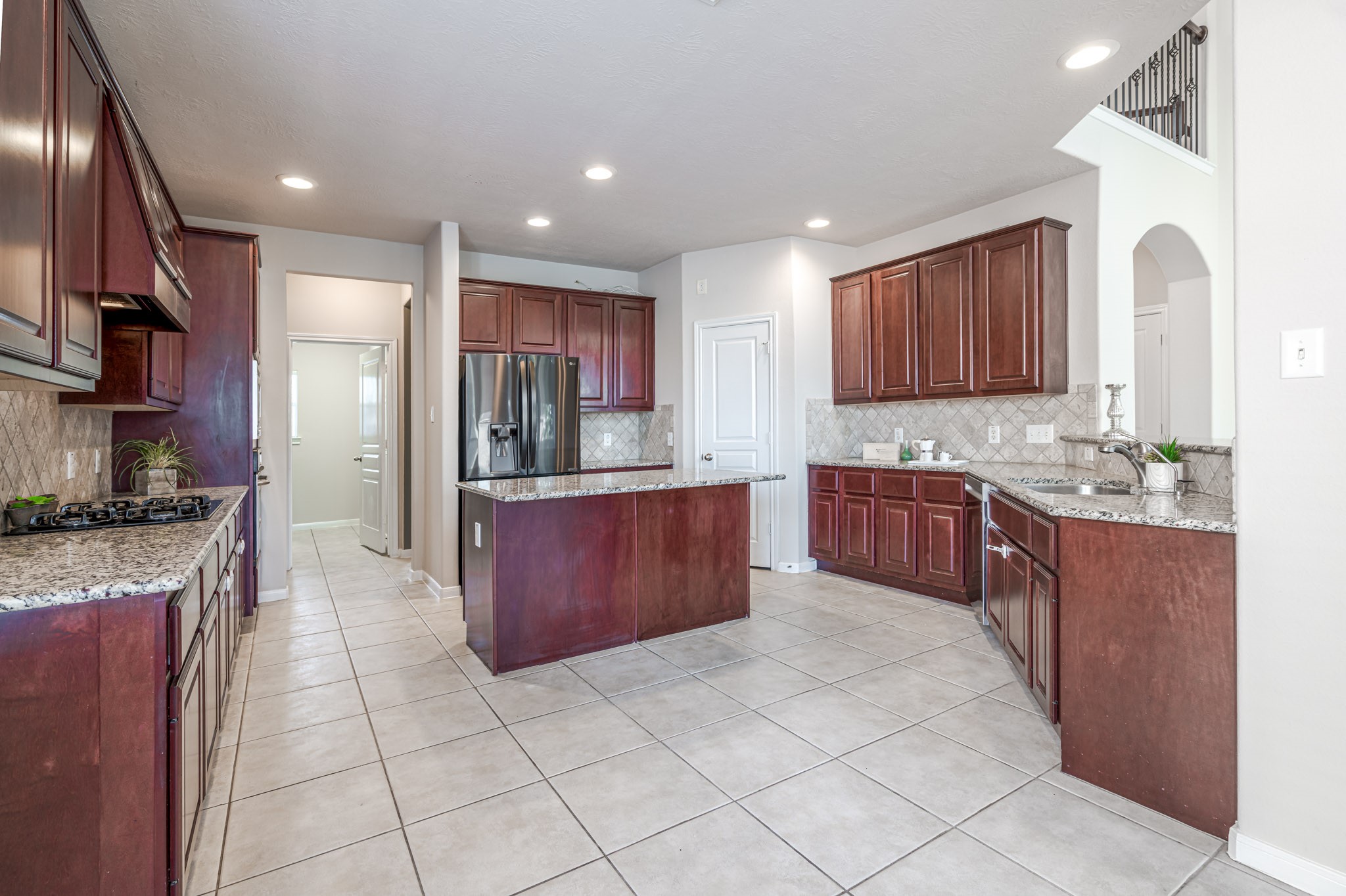 6518 Montana Ridge Court Houston, TX 77041 - Photo 5 of 27 a large kitchen with stainless steel appliances lots of counter top space