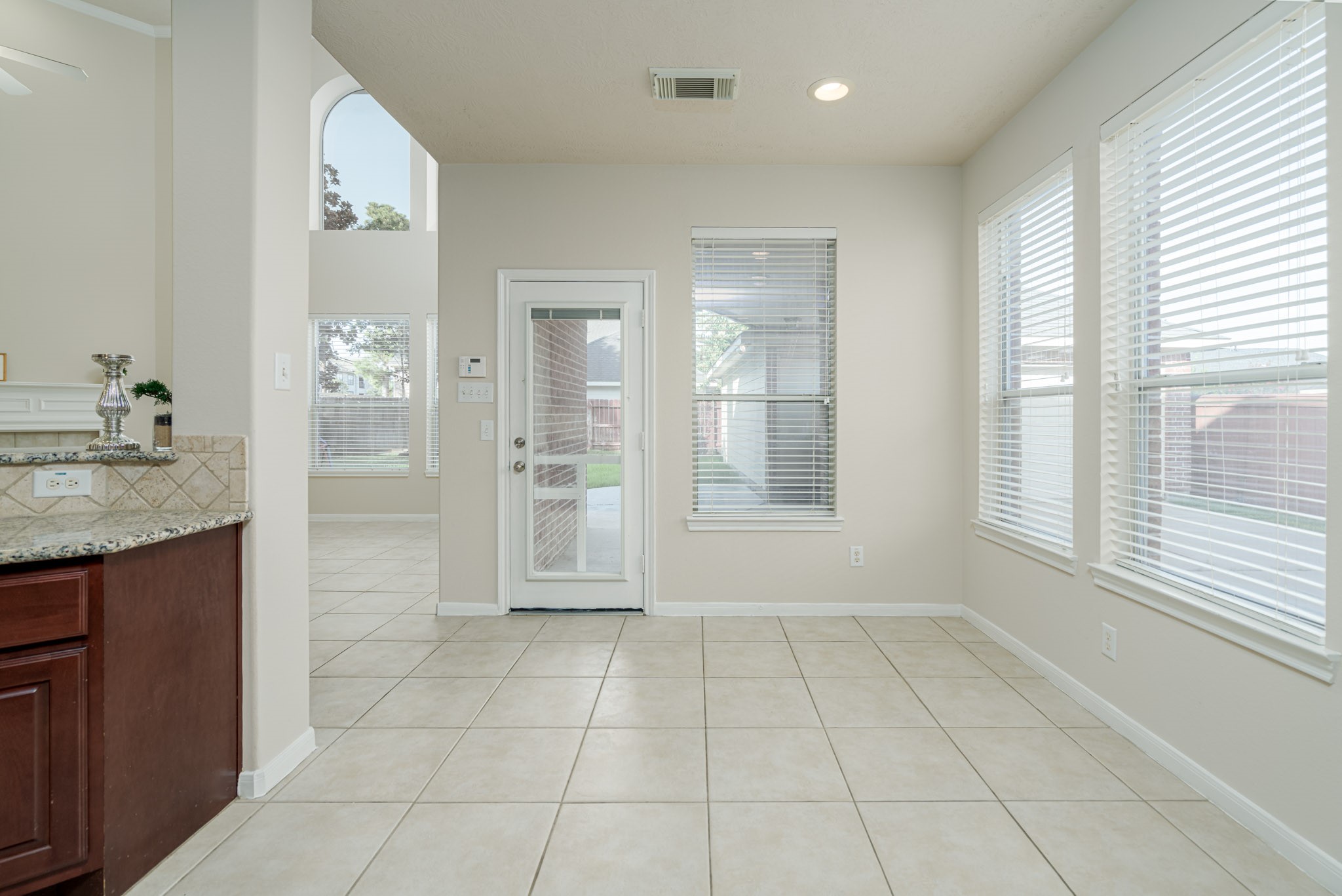 6518 Montana Ridge Court Houston, TX 77041 - Photo 6 of 27 a bathroom with a granite countertop sink a mirror and a shower
