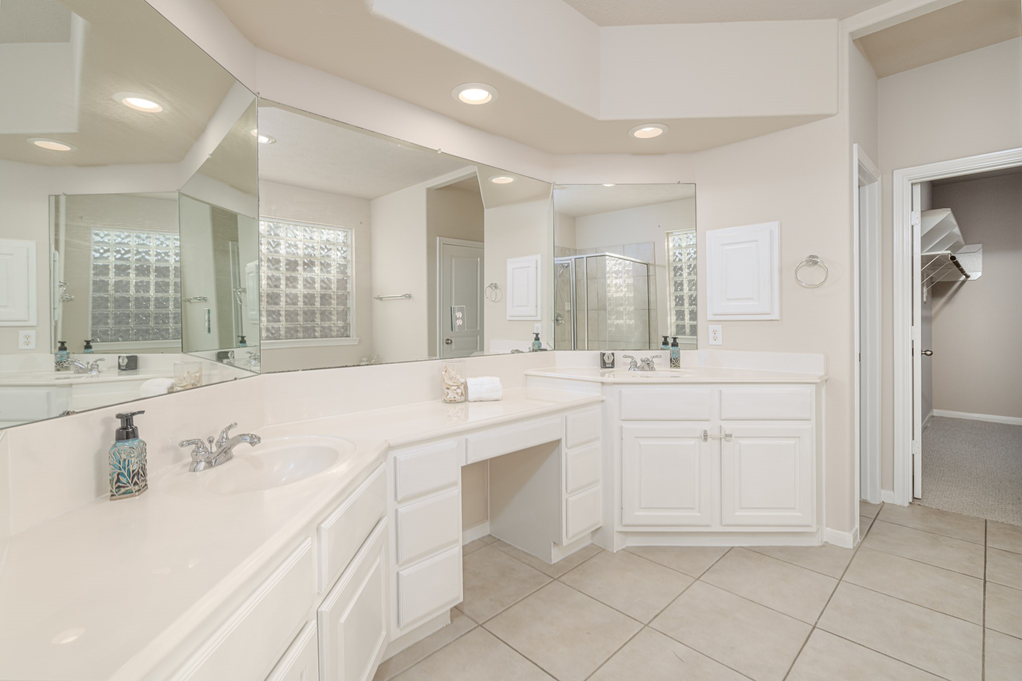 6518 Montana Ridge Court Houston, TX 77041 - Photo 8 of 27 a spacious bathroom with a sink a mirror a vanity and shower