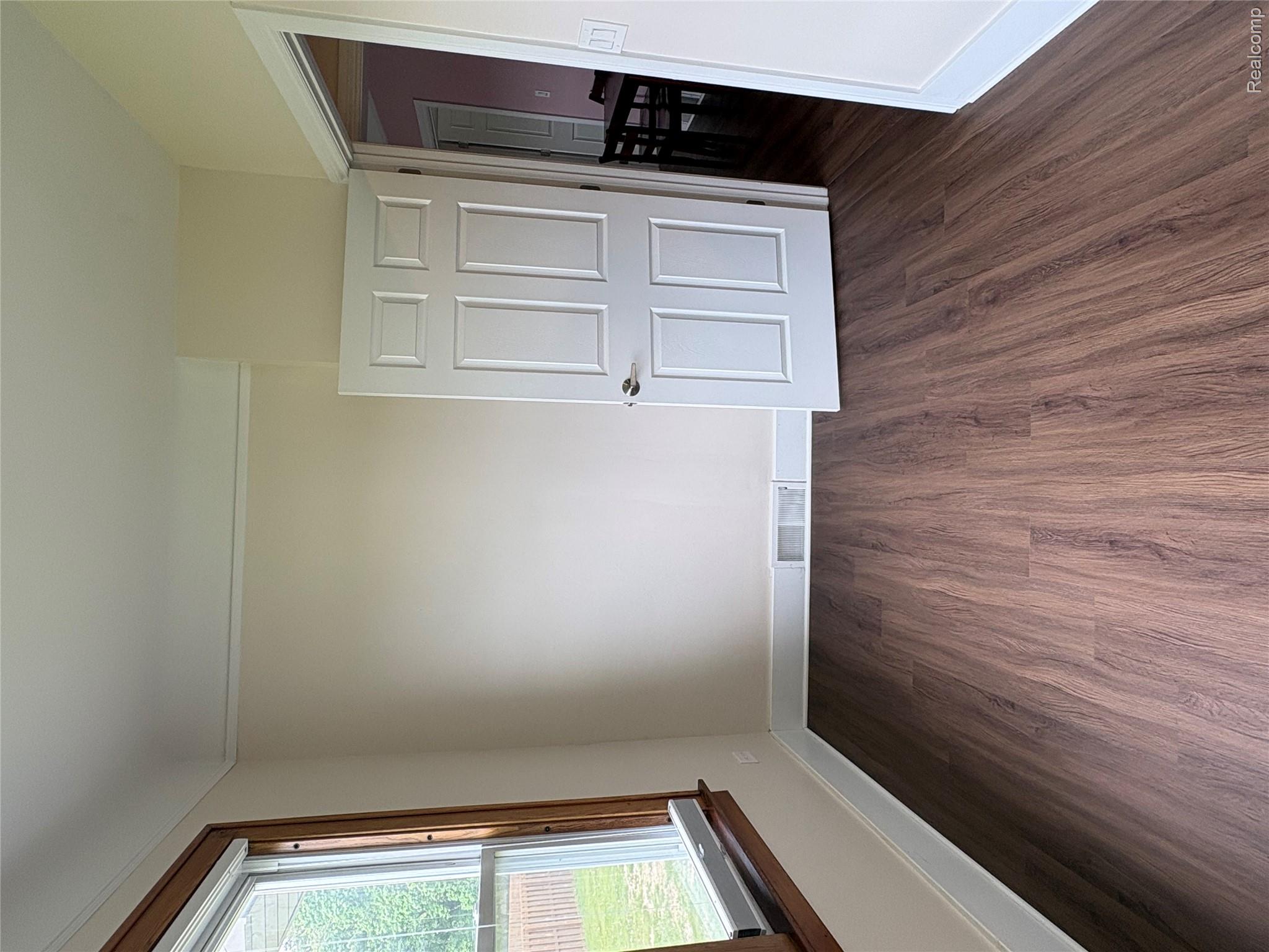 2175 West Auburn Road Rochester, MI 48309 - Photo 15 of 30 Unfurnished bedroom featuring dark wood-type flooring and baseboards