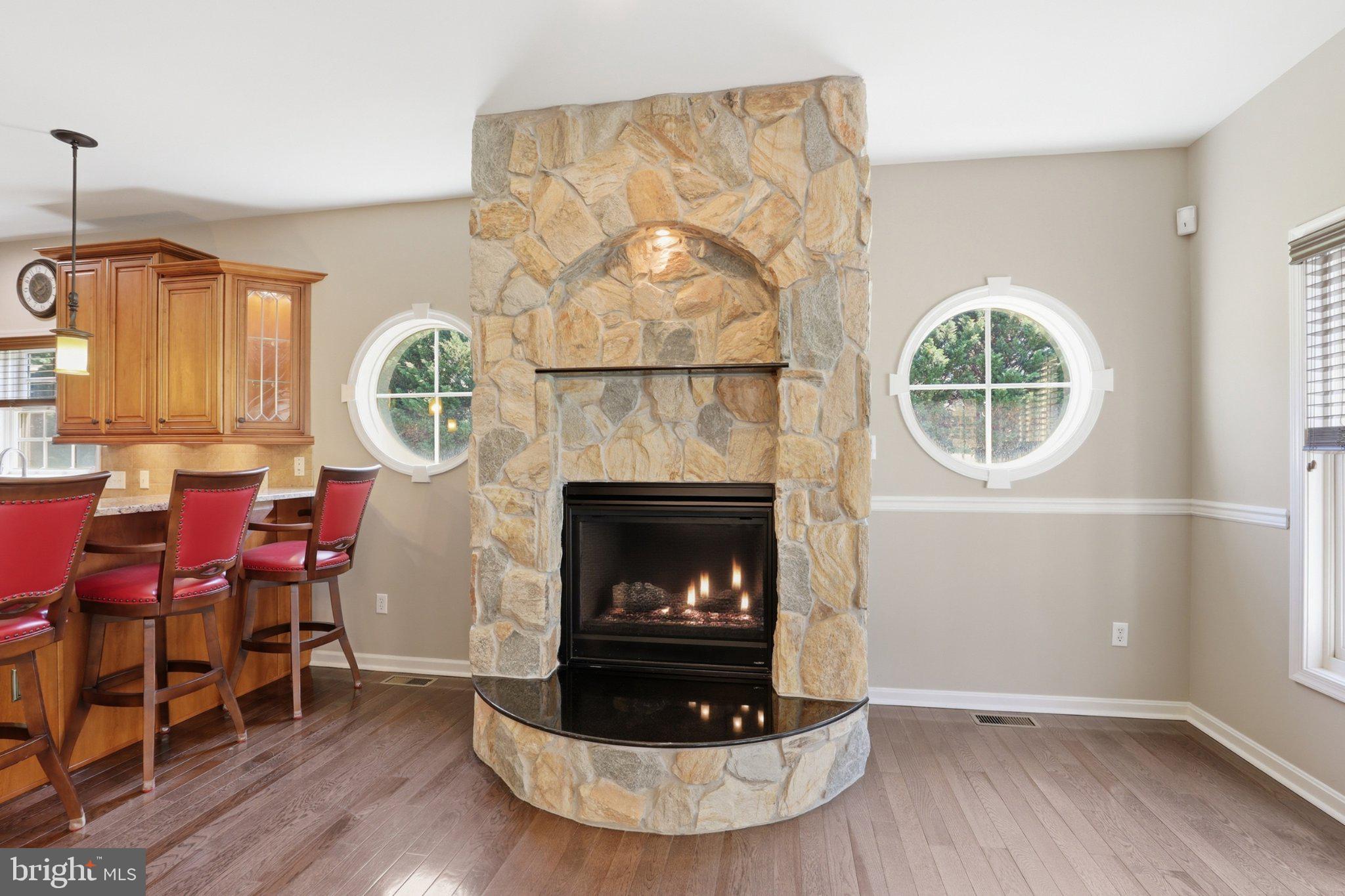 16932 Fitzgeralds Road Lincoln, DE 19960 - Photo 64 of 103 Cozy stone fireplace with circular windows.