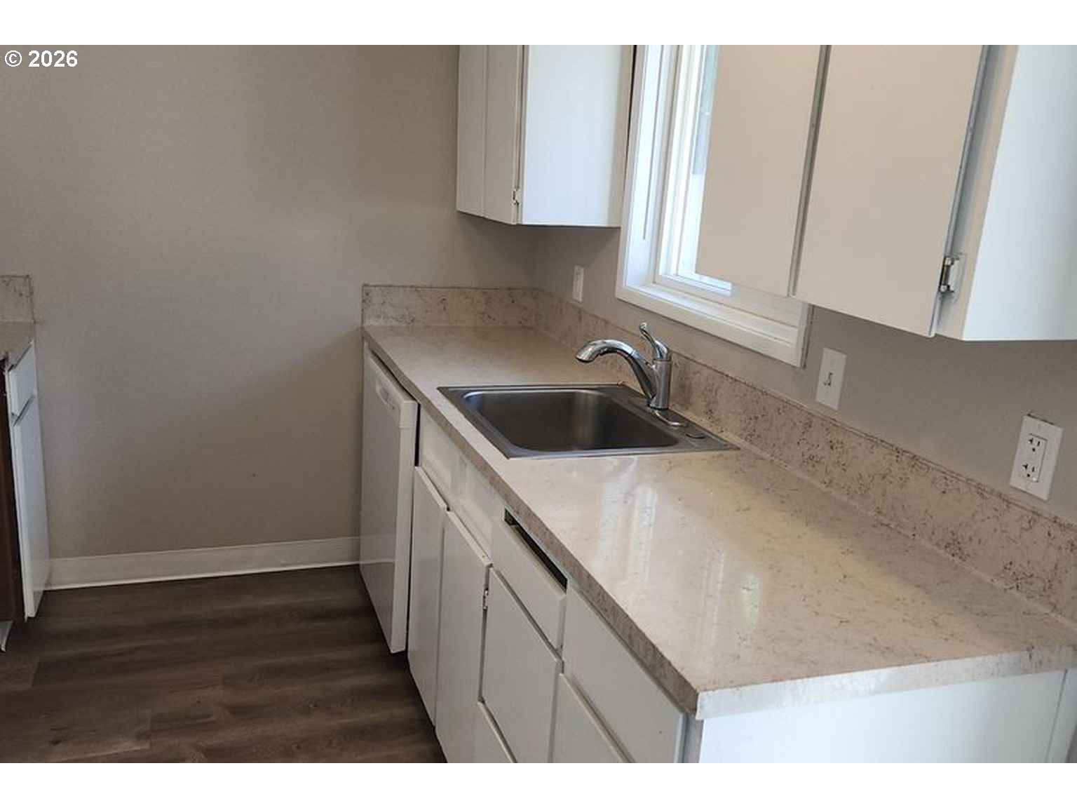3124 19th Place Forest Grove, OR 97116 - Photo 3 of 31 a kitchen with a sink and cabinets