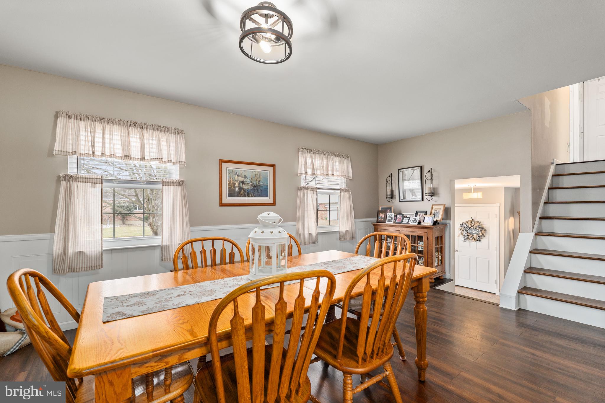 26 Southbridge Road Bear, DE 19701 - Photo 17 of 29 a view of a dining room with furniture a chandelier and wooden floor