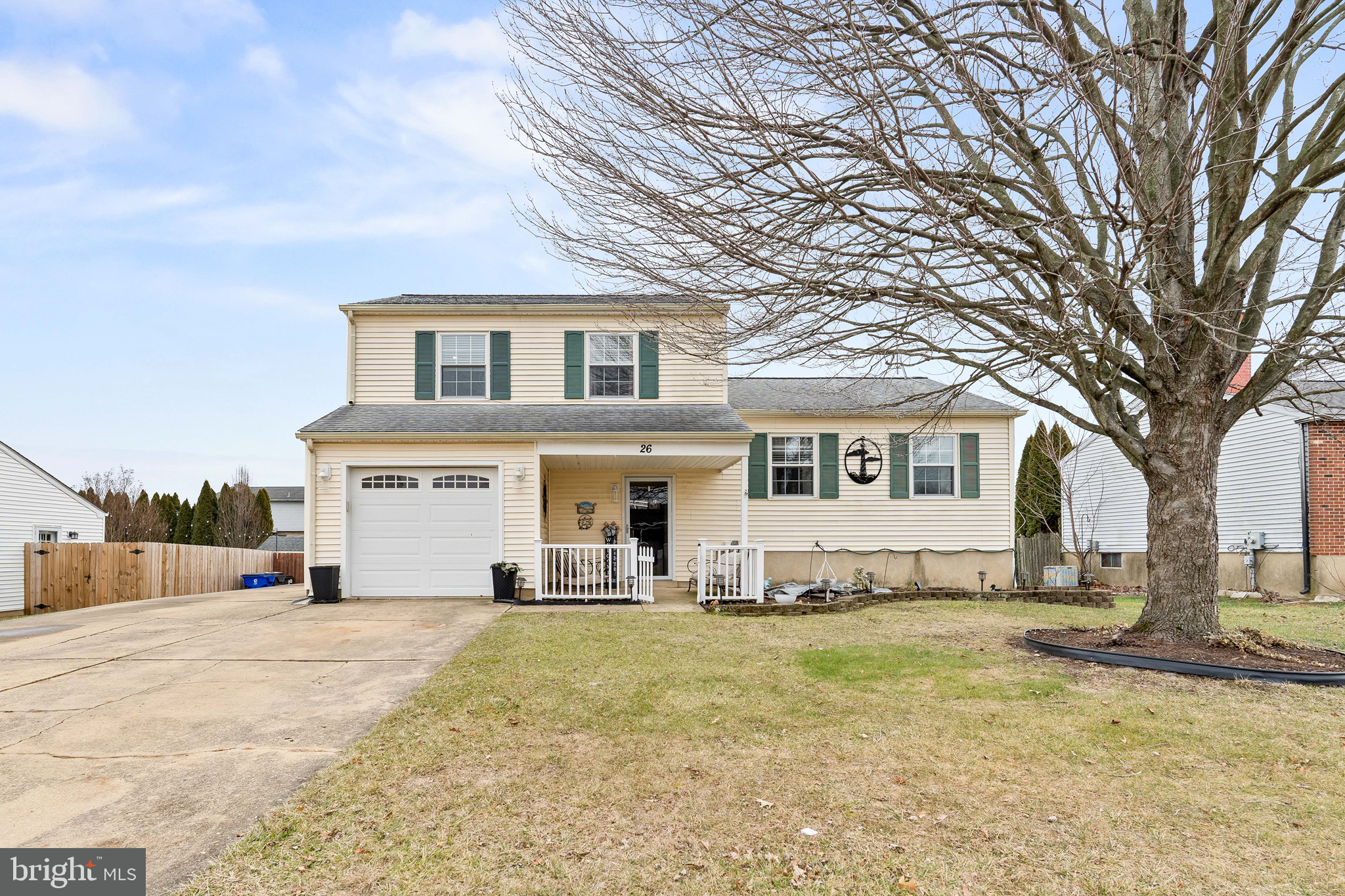 26 Southbridge Road Bear, DE 19701 - Photo 2 of 29 a view of a white house with a large tree in front of it