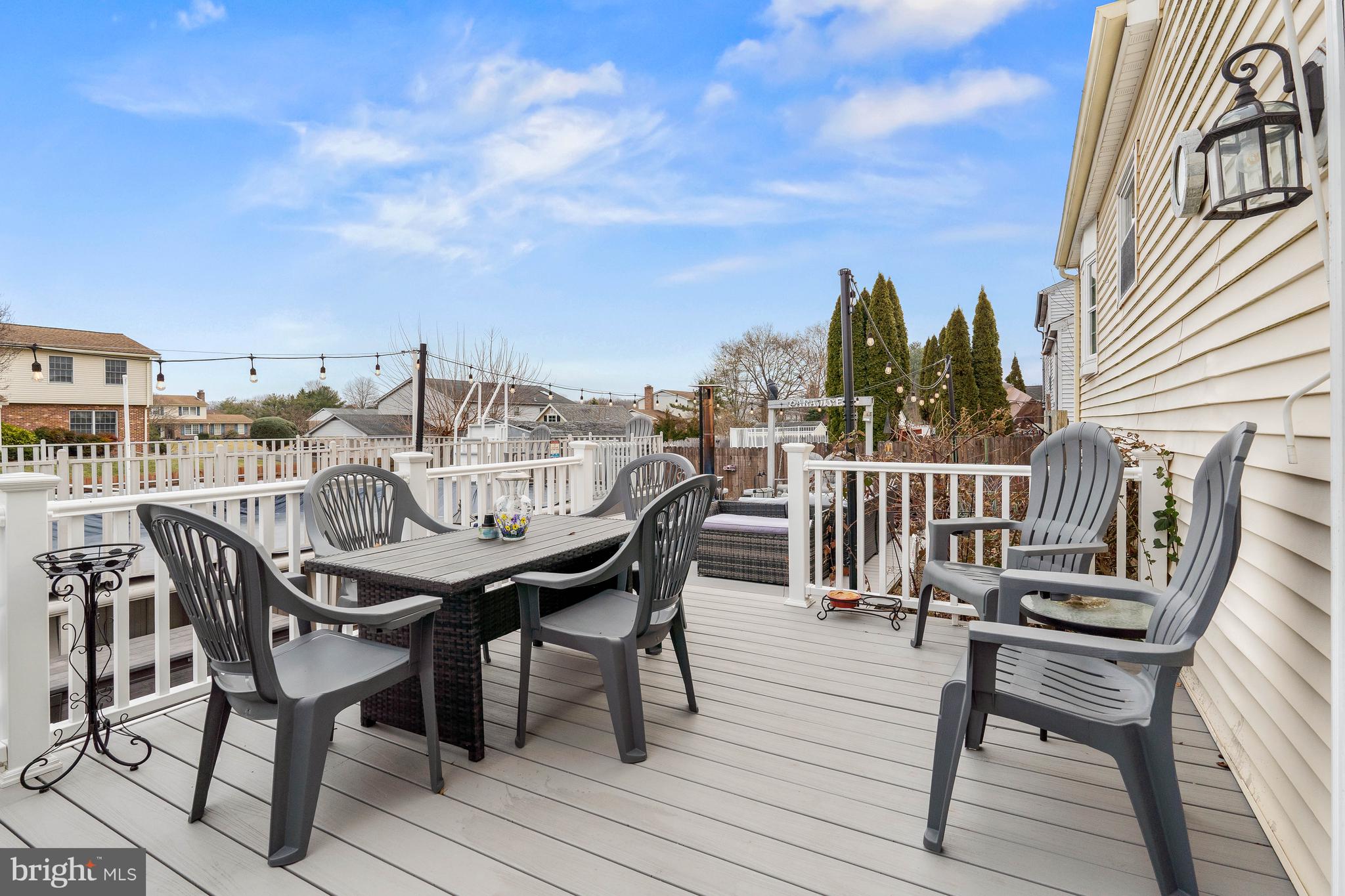 26 Southbridge Road Bear, DE 19701 - Photo 26 of 29 a view of a roof deck with table and chairs and wooden floor