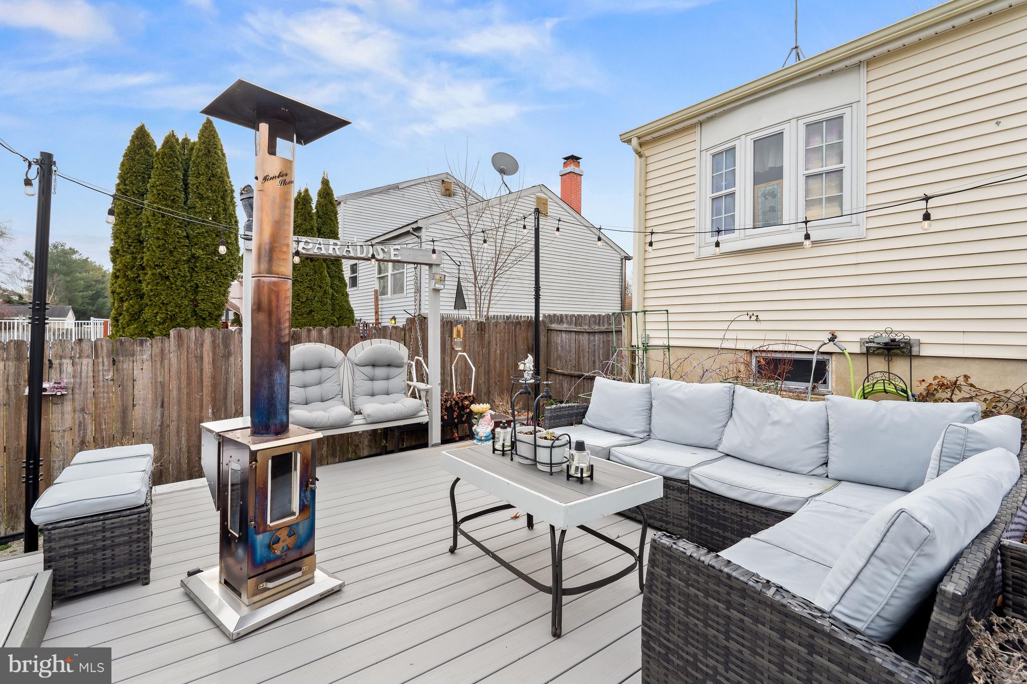26 Southbridge Road Bear, DE 19701 - Photo 29 of 29 a view of a patio with couches table and chairs and potted plants