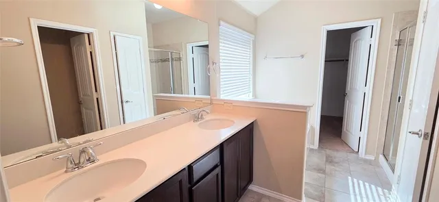 a bathroom with a tub and a shower