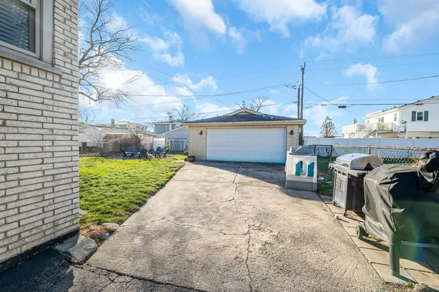 a front view of a house with a yard and a fountain