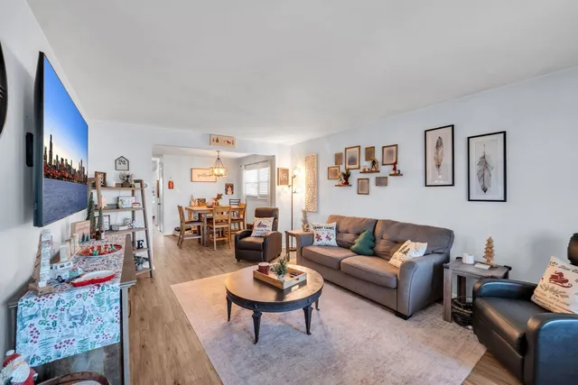 a living room with furniture and a rug