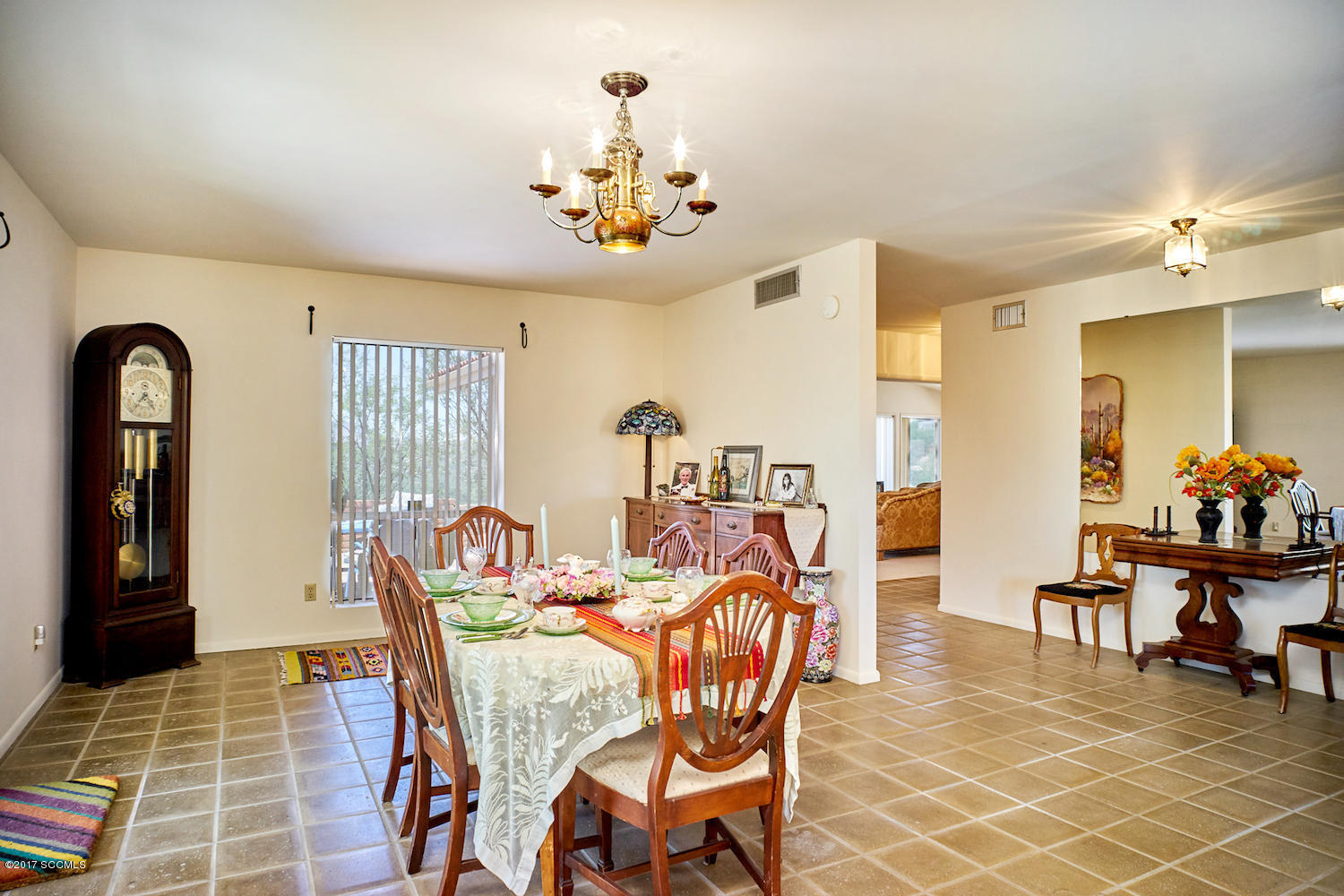 380 Rio Rico Drive Rio Rico, AZ 85648 - Photo 7 of 42 a view of a dining room with furniture and chandelier