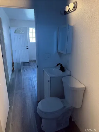 a bathroom with a toilet sink and vanity
