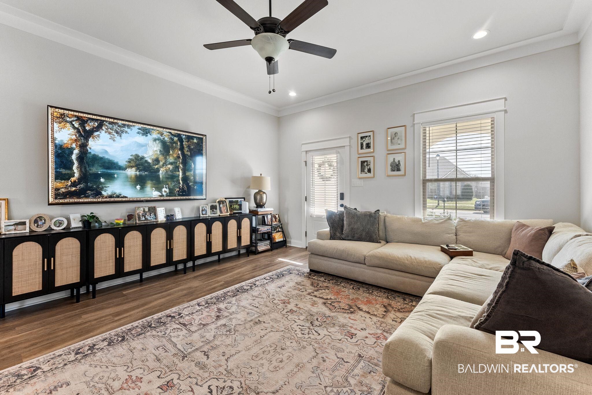 10745 Brodick Loop Daphne, AL 36527 - Photo 5 of 39 Living room with wood finished floors, crown molding, ceiling fan, and recessed lighting