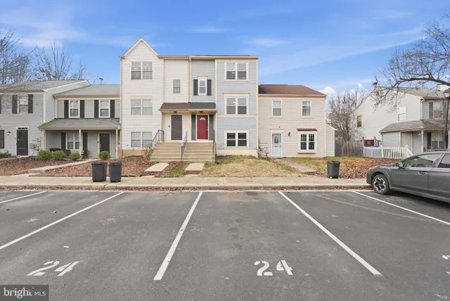 a view of a street that has couple of cars parked on the road