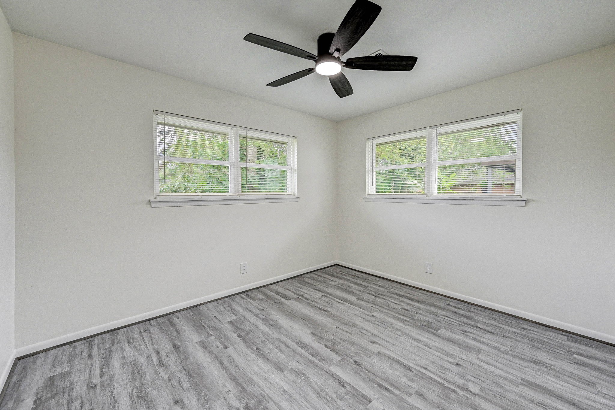 6027 Ledbetter Street Houston, TX 77087 - Photo 17 of 23 a view of empty room with wooden floor