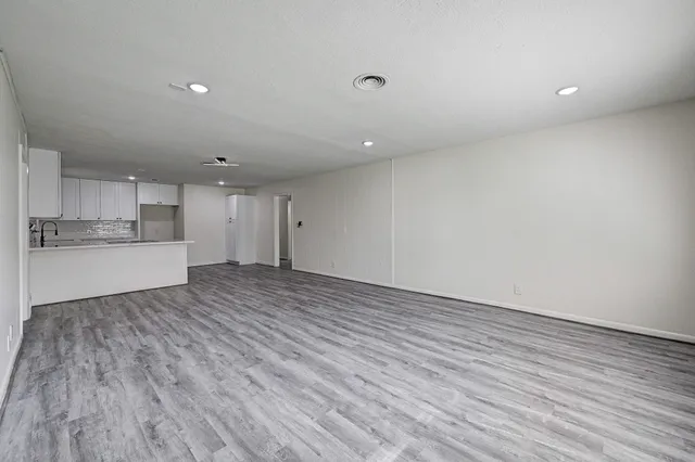 a view of kitchen and wooden floor
