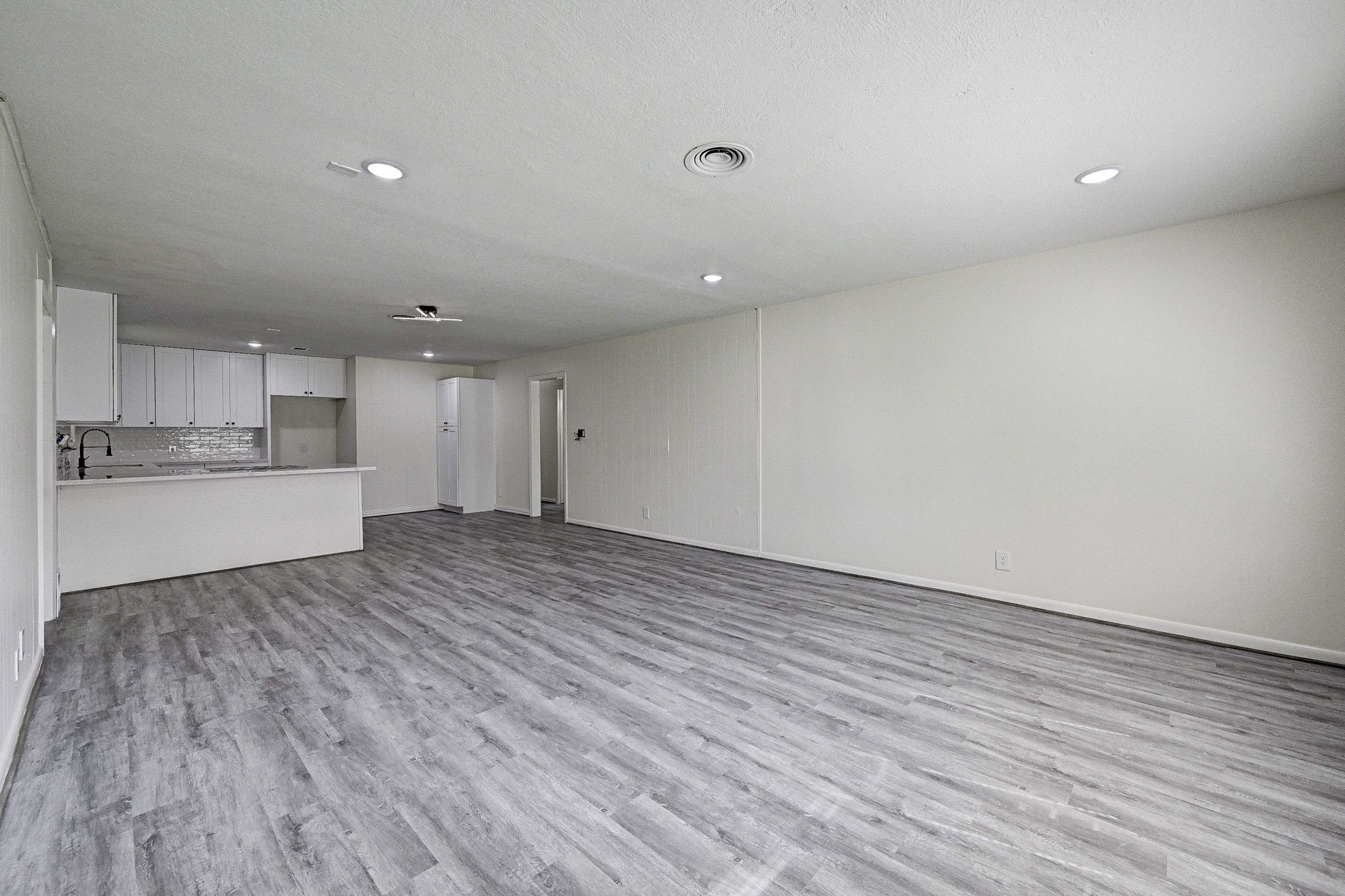 6027 Ledbetter Street Houston, TX 77087 - Photo 5 of 23 a view of kitchen with wooden floor