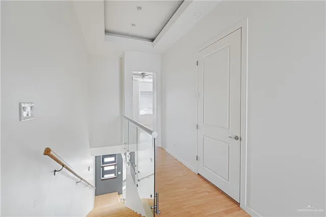 a view of a hallway with staircase