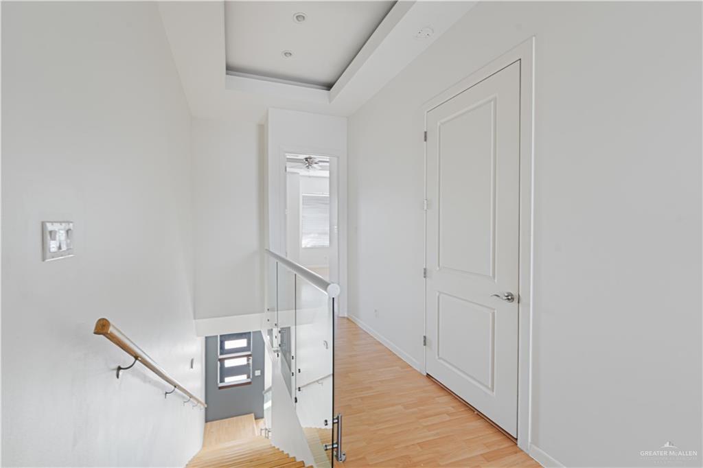 1209 Olympia Avenue, Unit 3 McAllen, TX 78503 - Photo 14 of 21 a view of a hallway with staircase