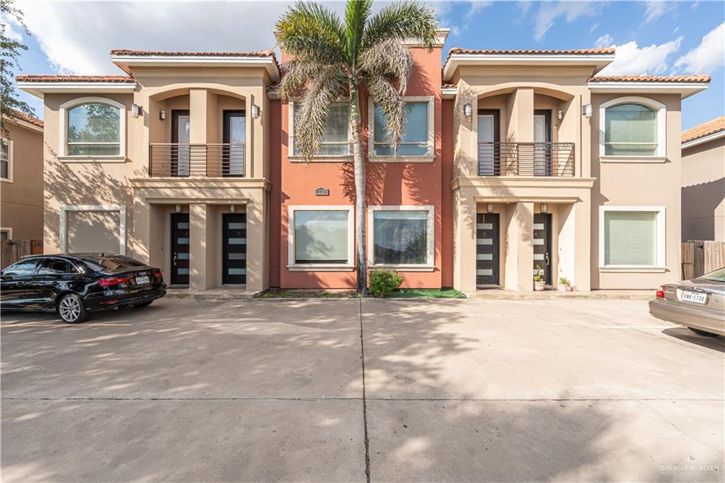 1209 Olympia Avenue, Unit 3 McAllen, TX 78503 - Photo 2 of 21 a view of a car park in front of a building