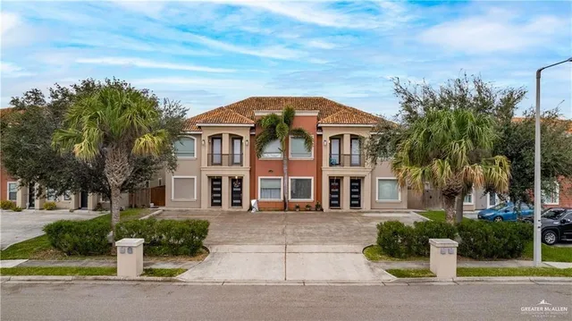 front view of a house with a garden