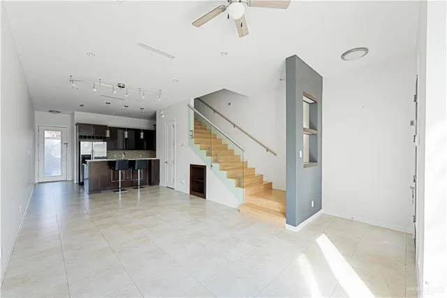 a view of livingroom with furniture and staircase