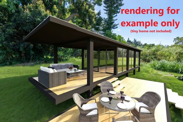 a view of a patio with table and chairs under an umbrella