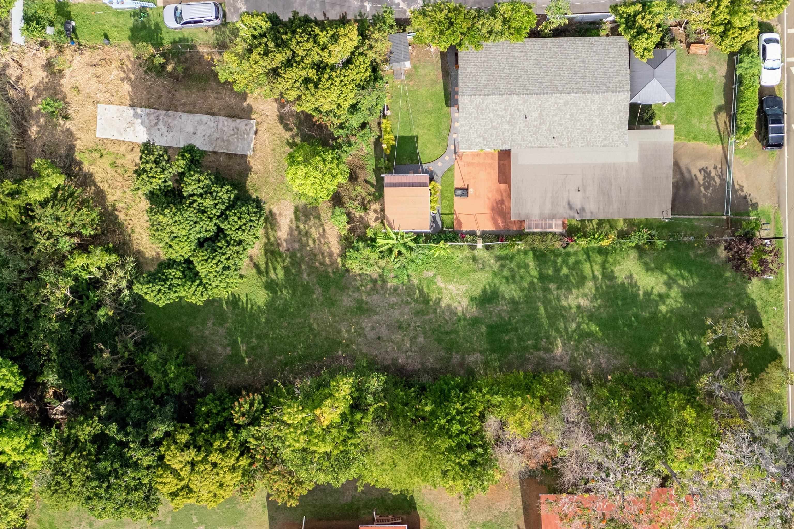 1706 Haiku Road Haiku, HI 96708 - Photo 19 of 28 an aerial view of a house with a yard and large trees