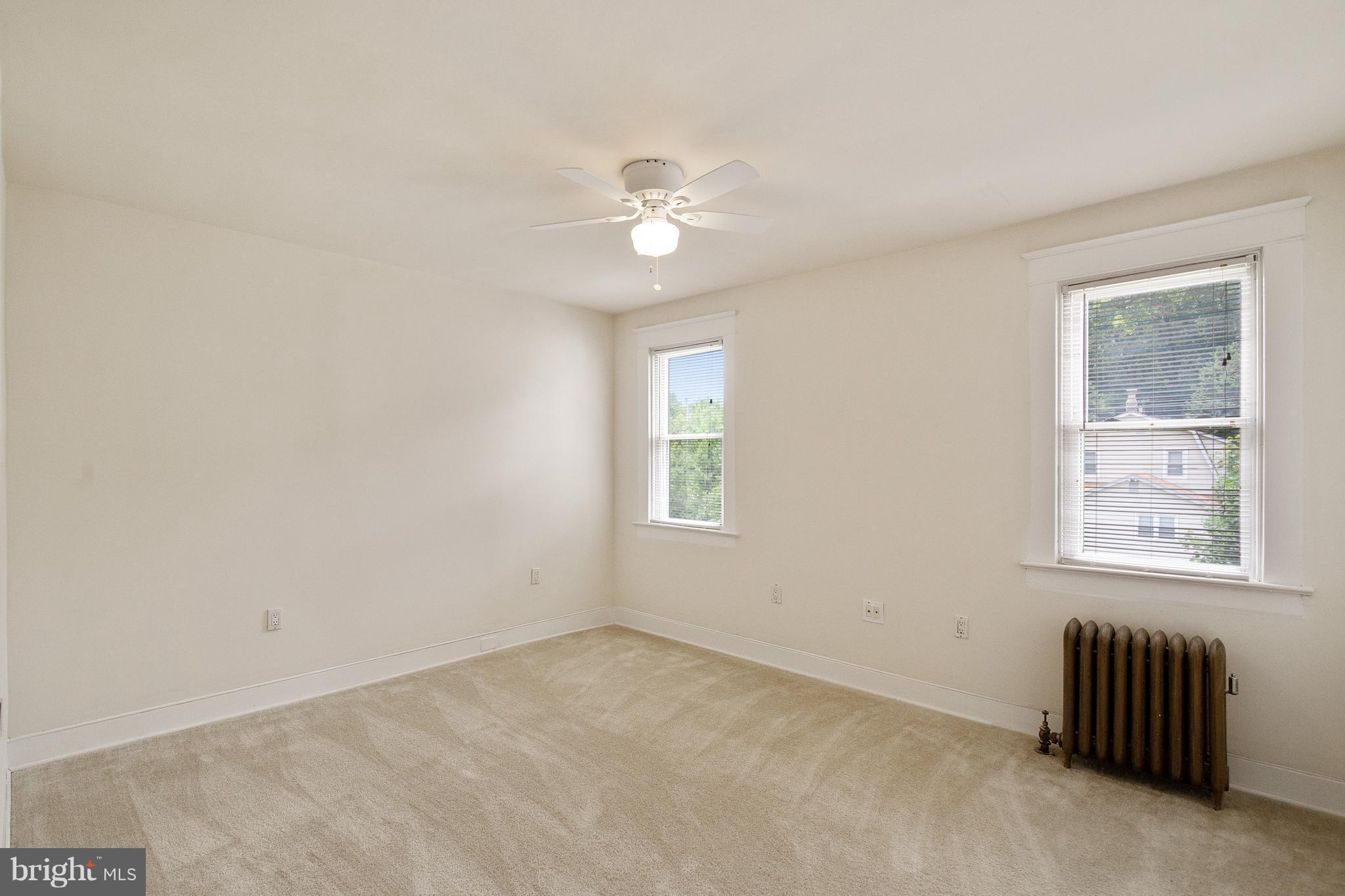 4 Ridge Road Baltimore, MD 21228 - Photo 14 of 21 an empty room with windows and fan