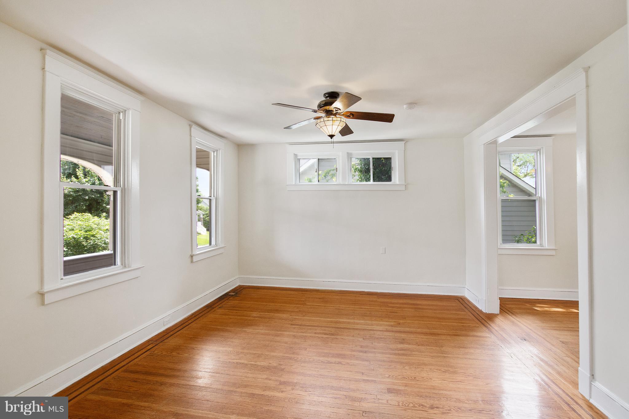 4 Ridge Road Baltimore, MD 21228 - Photo 3 of 21 wooden floor in an empty room with a window