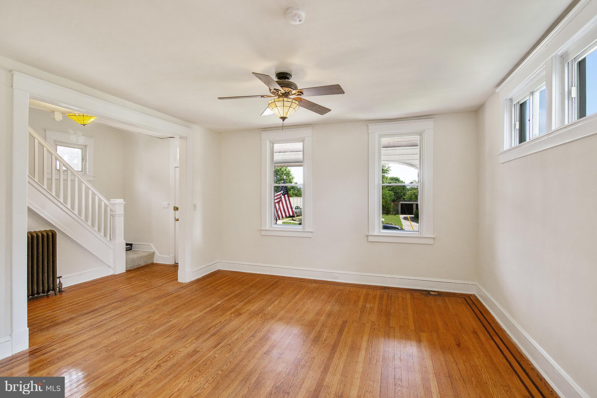 4 Ridge Road Baltimore, MD 21228 - Photo 4 of 21 a view of empty room with wooden floor and fan