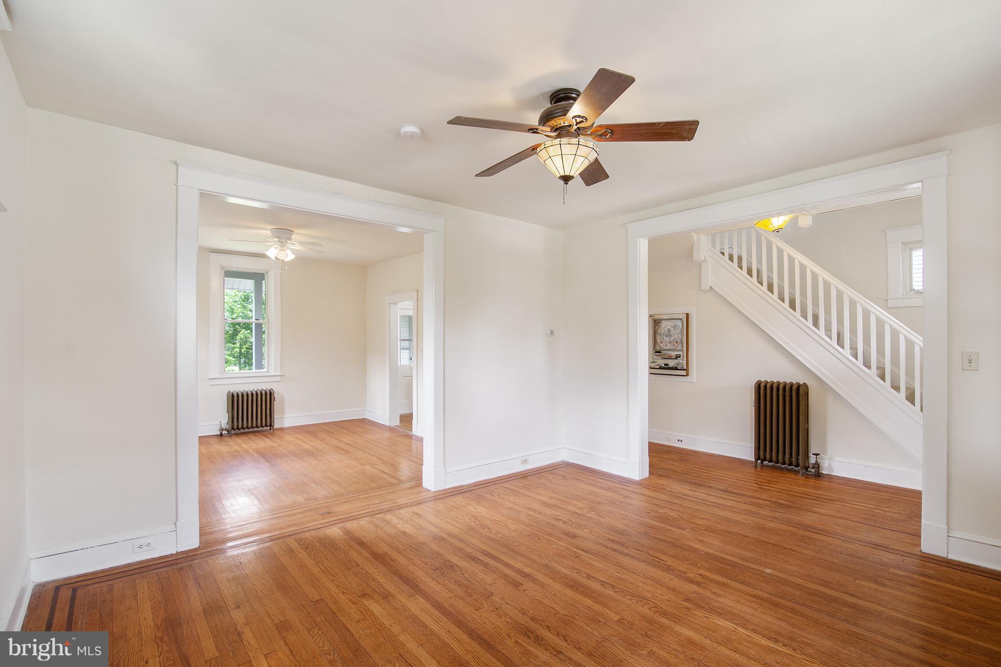 4 Ridge Road Baltimore, MD 21228 - Photo 5 of 21 a view of a livingroom with wooden floor and staircase