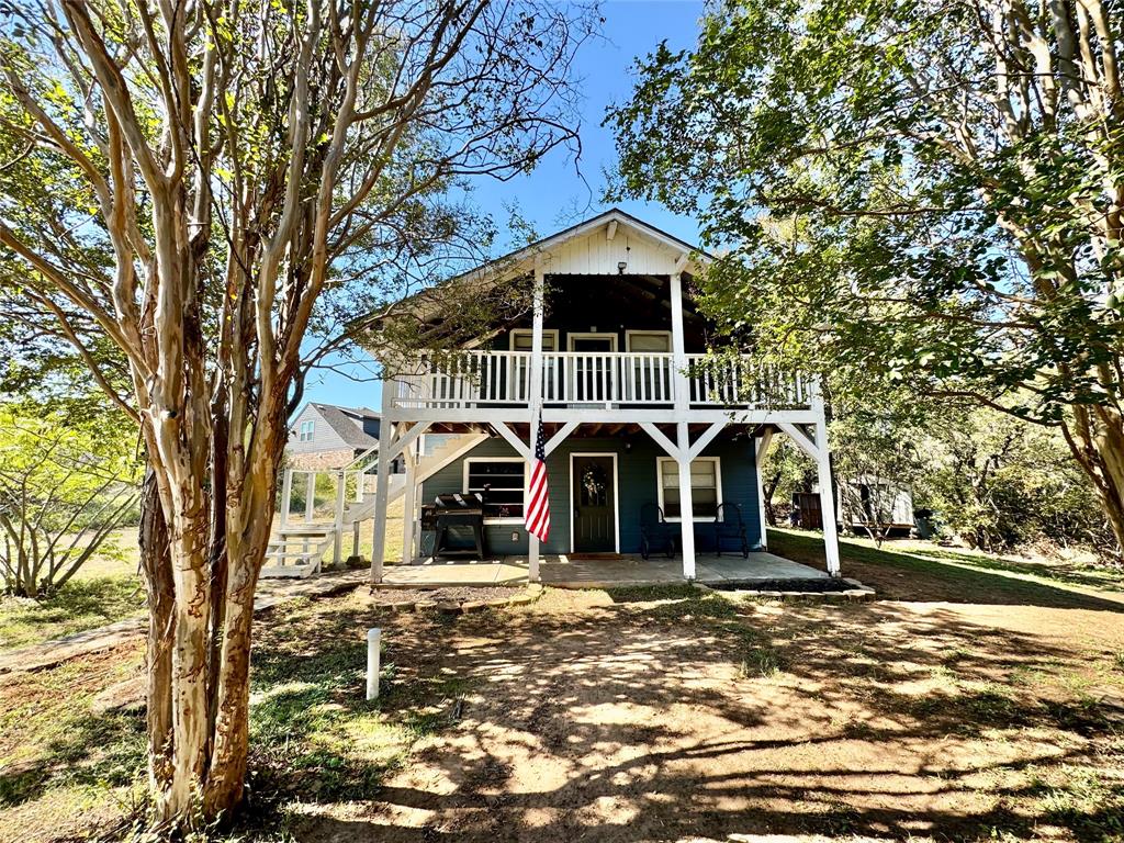 2504 Hillcrest Drive Granbury, TX 76048 - Photo 1 of 1 a front view of a house with parking space