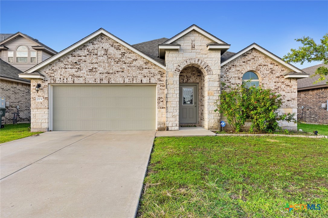 271 Bainbridge Road Temple, TX 76502 - Photo 1 of 36 a view of a house with a yard and garage