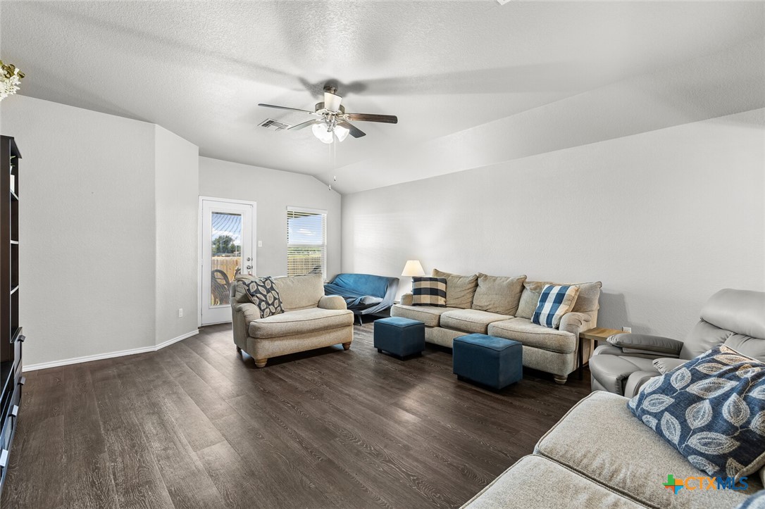271 Bainbridge Road Temple, TX 76502 - Photo 13 of 36 a living room with furniture and a wooden floor