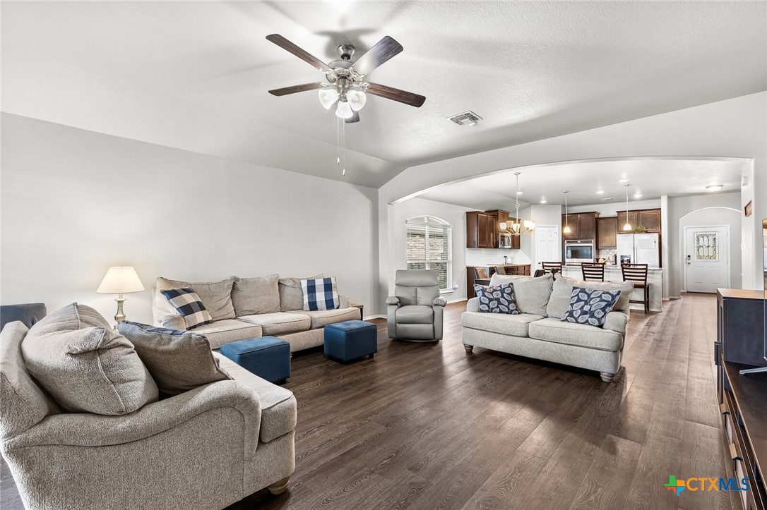 271 Bainbridge Road Temple, TX 76502 - Photo 15 of 36 a living room with furniture or chandelier and a wooden floor