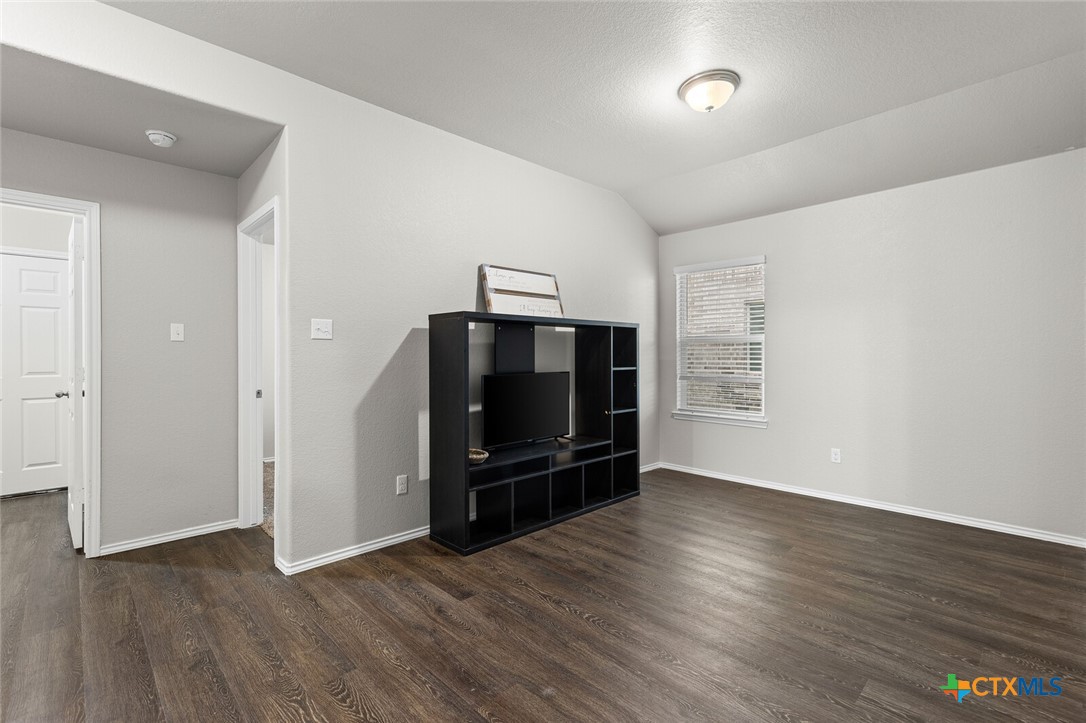 271 Bainbridge Road Temple, TX 76502 - Photo 22 of 36 an empty room with wooden floor closet and windows