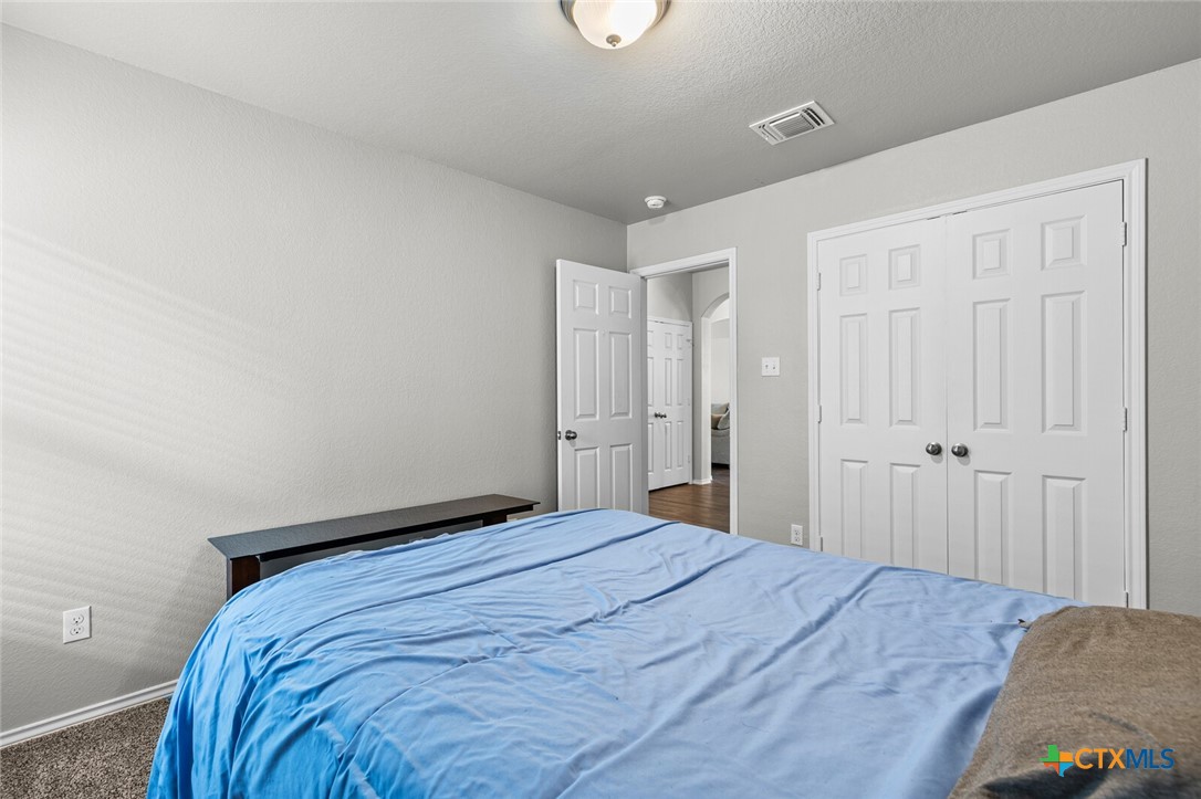 271 Bainbridge Road Temple, TX 76502 - Photo 25 of 36 a bedroom with a bed and closet