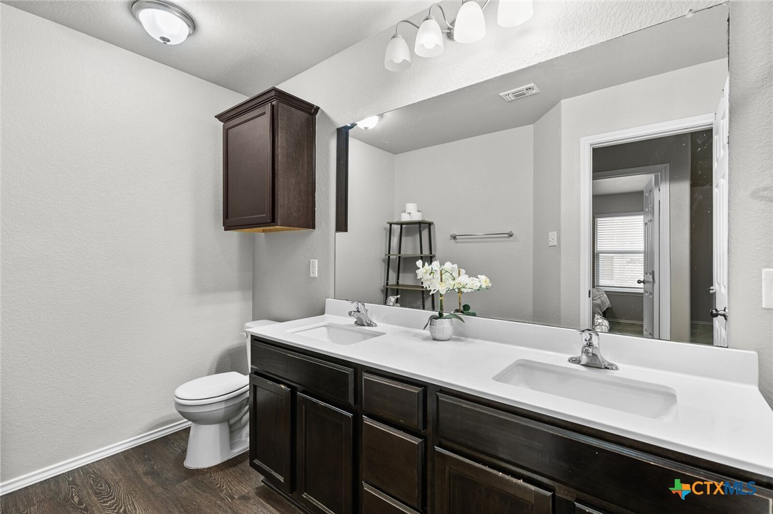271 Bainbridge Road Temple, TX 76502 - Photo 26 of 36 a bathroom with a double vanity sink and a mirror