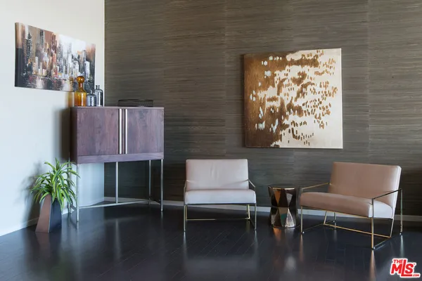 a reading room with furniture and a flat screen tv