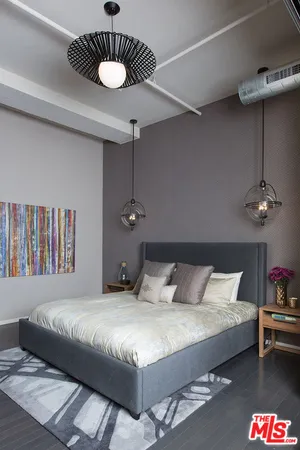 a bedroom with a bed and ceiling fan