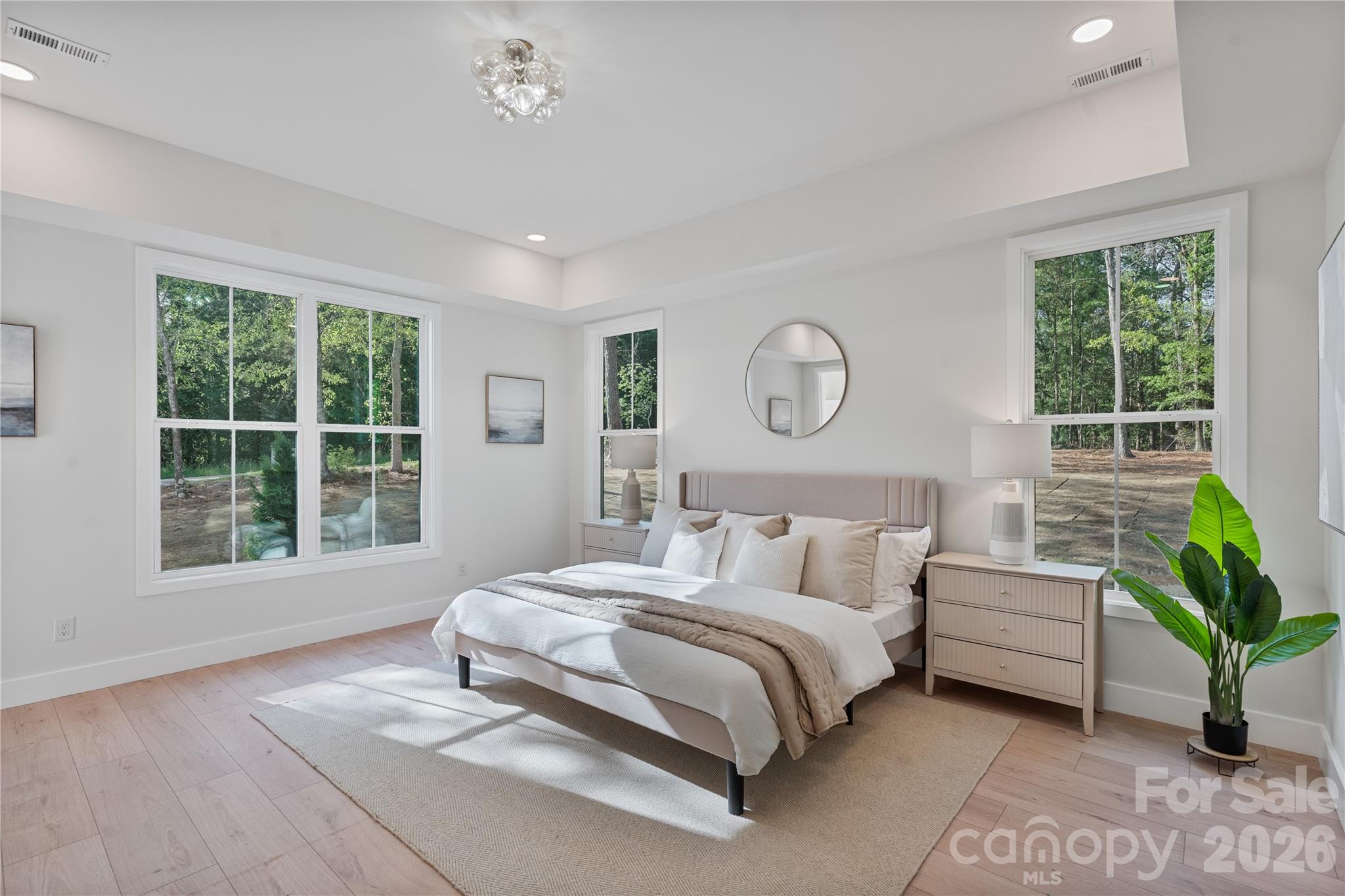 460 Riddle Mill Road Clover, SC 29710 - Photo 16 of 48 a spacious bedroom with a bed couch and window