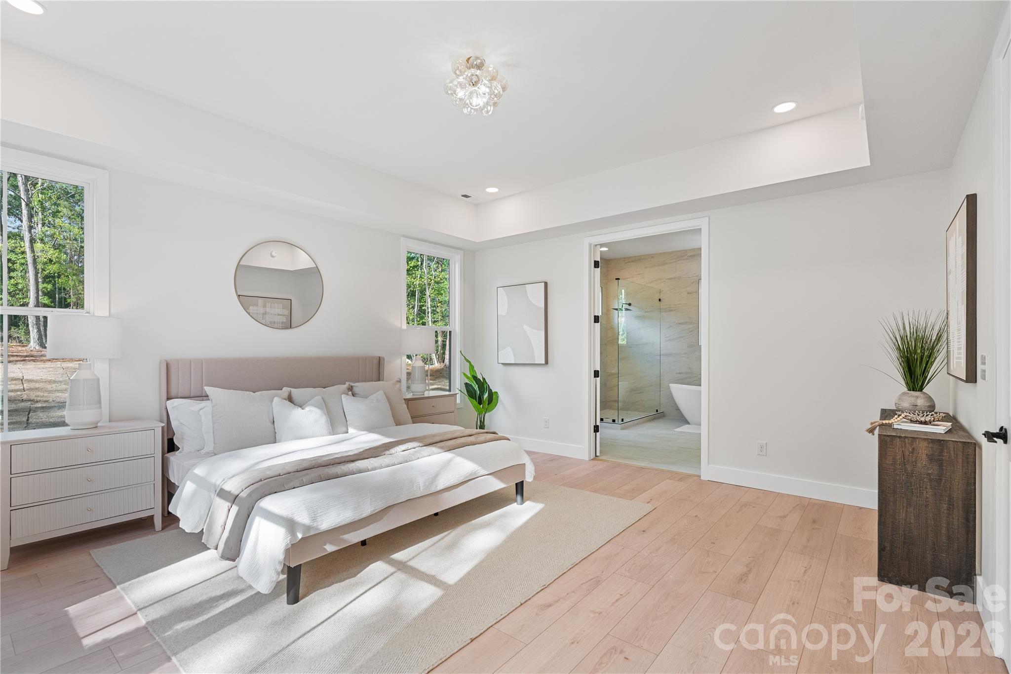 460 Riddle Mill Road Clover, SC 29710 - Photo 20 of 48 a bedroom with a bed and a potted plant